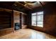 Elegant living room featuring hardwood floors, custom built-ins, fireplace, and a large window for natural light at 6213 Arnall Nw Ct, Acworth, GA 30101