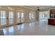 Open concept living space with French doors, large windows, and a view to the kitchen, blending comfort and style at 6213 Arnall Nw Ct, Acworth, GA 30101