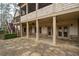 Expansive stone patio with ceiling fans, offering the perfect outdoor entertaining space at 6213 Arnall Nw Ct, Acworth, GA 30101