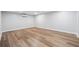 A newly renovated basement with wood-look flooring and mini-split air conditioner at 3343 Mooring Dr, Powder Springs, GA 30127