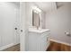 This is a bathroom vanity with modern mirror and stainless steel hardware at 3343 Mooring Dr, Powder Springs, GA 30127