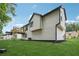 Backyard view featuring a deck, green grass, and the home's exterior at 3343 Mooring Dr, Powder Springs, GA 30127