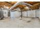 Spacious garage with visible piping, concrete floor, and two garage doors at 3343 Mooring Dr, Powder Springs, GA 30127