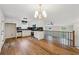 Modern kitchen with stainless steel appliances, white cabinets, and hardwood floors at 3343 Mooring Dr, Powder Springs, GA 30127