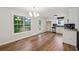 Charming kitchen and dining area with hardwood floors, a view of the backyard, and modern appliances at 3343 Mooring Dr, Powder Springs, GA 30127