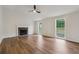 Bright living room with a cozy fireplace, ample natural light, and sleek hardwood floors at 3343 Mooring Dr, Powder Springs, GA 30127