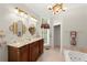 Elegant bathroom with a marble countertop, double vanity, and jacuzzi tub at 3863 Streamside Se Dr, Marietta, GA 30067