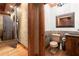 Intricately designed bathroom with wood accents and stone sink, creating a luxurious and unique space at 3863 Streamside Se Dr, Marietta, GA 30067