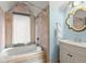 Cozy bathroom featuring a tub and shower with custom tile and vanity at 3863 Streamside Se Dr, Marietta, GA 30067
