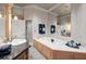 Luxurious bathroom featuring a jacuzzi tub, double vanity, and marble countertops at 3863 Streamside Se Dr, Marietta, GA 30067