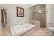 Bathroom with a soaking tub and glass shower at 3863 Streamside Se Dr, Marietta, GA 30067