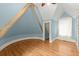 A blue bedroom with hard wood floors and natural light at 3863 Streamside Se Dr, Marietta, GA 30067