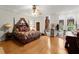 Spacious main bedroom with hardwood floors and large windows at 3863 Streamside Se Dr, Marietta, GA 30067