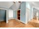 A blue bedroom with hard wood floors and built in storage at 3863 Streamside Se Dr, Marietta, GA 30067