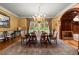 Formal dining room with large windows, chandelier, and ornate detailing at 3863 Streamside Se Dr, Marietta, GA 30067