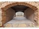 Unique stone fireplace with tunnel-like design, creating a captivating architectural focal point at 3863 Streamside Se Dr, Marietta, GA 30067
