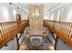 Foyer with hard wood floors, stone feature and custom lighting at 3863 Streamside Se Dr, Marietta, GA 30067