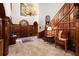 A grand foyer with a dark wood staircase, marble floors, wood details, and beautiful decor at 3863 Streamside Se Dr, Marietta, GA 30067