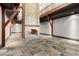 Open-concept great room with stone fireplace and exposed beams, ideal for gathering and entertaining at 3863 Streamside Se Dr, Marietta, GA 30067