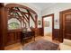 Beautiful wood trim details and ceiling details in this hallway with an ornate rug on hardwood floors at 3863 Streamside Se Dr, Marietta, GA 30067