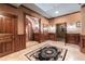 Elegant hallway features rich wood trim, tiled floors, and arched doorways, exuding a sense of timeless charm at 3863 Streamside Se Dr, Marietta, GA 30067