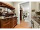 Traditional hallway featuring a built in buffet and marble countertops that leads into a living room at 3863 Streamside Se Dr, Marietta, GA 30067