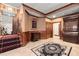 Spacious hallway showcases a staircase, tiled flooring, and exquisite wooden detailing, creating a grand entrance at 3863 Streamside Se Dr, Marietta, GA 30067