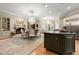 Open-concept kitchen boasts a central island, gas cooktop, and stainless steel appliances at 3863 Streamside Se Dr, Marietta, GA 30067