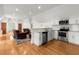 Open-concept kitchen with stainless steel appliances and hardwood floors at 3863 Streamside Se Dr, Marietta, GA 30067