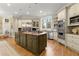 Gourmet kitchen with granite countertops, a center island, and stainless steel appliances at 3863 Streamside Se Dr, Marietta, GA 30067
