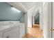 Hallway laundry room with updated machines at 3863 Streamside Se Dr, Marietta, GA 30067