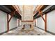 A spacious living room with a stone fireplace that divides the room and has matching elevated sitting areas at 3863 Streamside Se Dr, Marietta, GA 30067