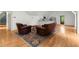 Spacious living room with hardwood floors, a kitchenette, and comfortable seating at 3863 Streamside Se Dr, Marietta, GA 30067