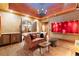 Spacious living room with rustic wood floors, stone ceiling, and ample seating, perfect for entertaining guests at 3863 Streamside Se Dr, Marietta, GA 30067