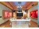 Comfortable living room with a rustic chandelier, wood-paneled walls, and custom lighting, creating a unique ambiance at 3863 Streamside Se Dr, Marietta, GA 30067