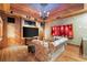 Charming living room features wood floors, modern TV, and a stone ceiling, offering a cozy space at 3863 Streamside Se Dr, Marietta, GA 30067
