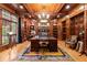 A distinguished home office featuring custom wood shelves, walls, and a large window for natural light at 3863 Streamside Se Dr, Marietta, GA 30067
