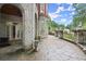 Expansive stone patio with brick and stone architecture, perfect for entertaining at 3863 Streamside Se Dr, Marietta, GA 30067