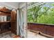 Balcony features brickwork, french doors, and a beautiful view of the lush surroundings at 3863 Streamside Se Dr, Marietta, GA 30067