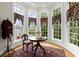 Bedroom sitting area with curved windows providing a view to the outdoors at 3863 Streamside Se Dr, Marietta, GA 30067