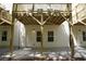 View of the home's exterior, highlighting the deck support structure and access doors at 4970 Villager Ln, Stone Mountain, GA 30083