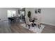 Eat-in kitchen with gray cabinets, stainless steel appliances, granite countertops, and seating for four at the breakfast bar at 4970 Villager Ln, Stone Mountain, GA 30083