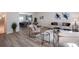 A light and airy living room showcases modern furniture, hardwood floors, and an open-concept layout at 4970 Villager Ln, Stone Mountain, GA 30083