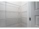 Walk-in pantry with wire shelving providing ample storage space for food and household items at 4970 Villager Ln, Stone Mountain, GA 30083