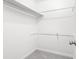 Walk-in closet with ample hanging space and neutral carpeting at 507 Embers Se Dr, Marietta, GA 30067