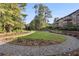 Beautifully landscaped community green with walkways and sitting area at 507 Embers Se Dr, Marietta, GA 30067