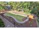 Overhead view of community green, with landscaped walkways, sitting area and trees at 507 Embers Se Dr, Marietta, GA 30067