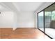 Bright living room with wood floors, neutral walls, and sliding glass doors to a private patio at 507 Embers Se Dr, Marietta, GA 30067