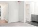 Neutral living room showcasing multiple doorways to kitchen, bedrooms and bathrooms at 507 Embers Se Dr, Marietta, GA 30067