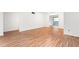 Bright living room with hardwood floors, white walls, and a sliding glass door to a private balcony at 507 Embers Se Dr, Marietta, GA 30067